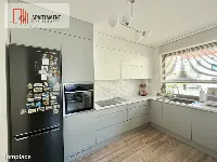 Nowoczesny apartament z dwoma balkonami oraz windą — zdjęcie 7