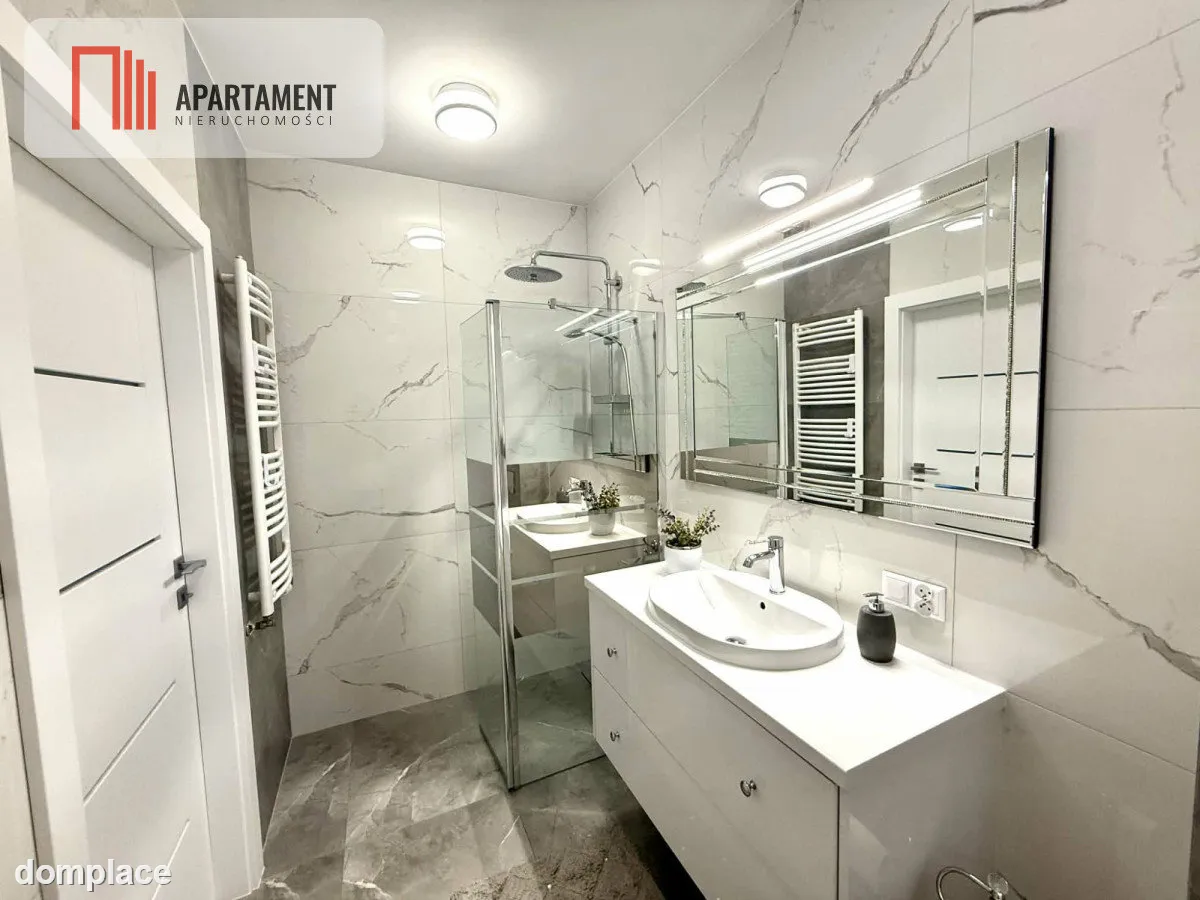 Nowoczesny apartament z dwoma balkonami oraz windą — zdjęcie 11