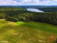 Działka budowlana w pobliżu jeziora. — zdjęcie 1