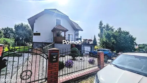 Atrakcyjny dom z piękną działką w Nowogrodźcu — zdjęcie 4